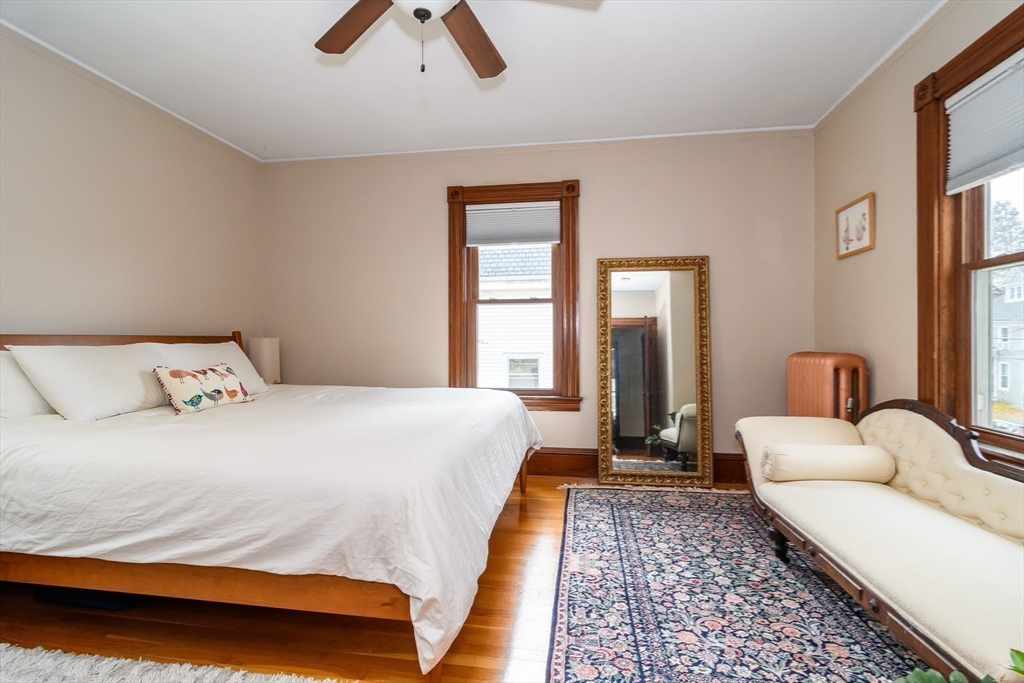 16 Alexander Street Framingham, MA 01702 - Photo 19 of 35 a bedroom with a bed wooden floor and window