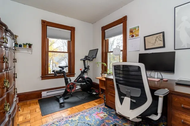 a room with furniture a flat screen tv and a window