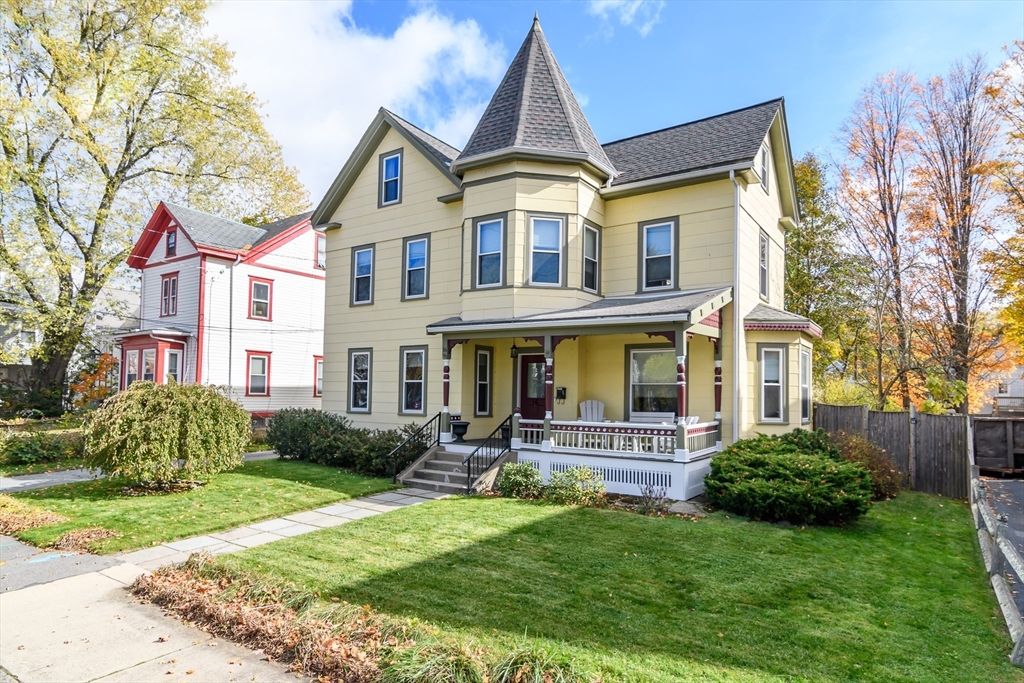 16 Alexander Street Framingham, MA 01702 - Photo 2 of 35 a front view of a house with porch and garden