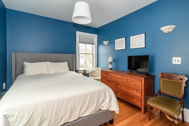 a bedroom with bed and window