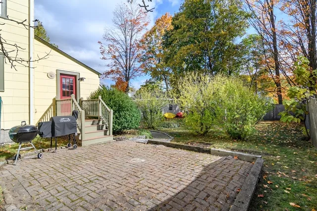 a view of backyard with parked area