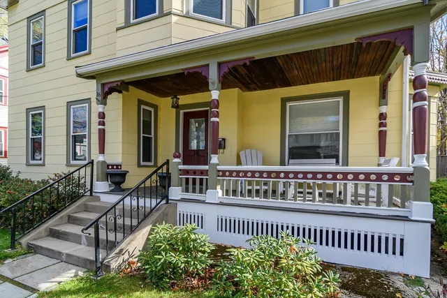 a view of a house with wooden fence