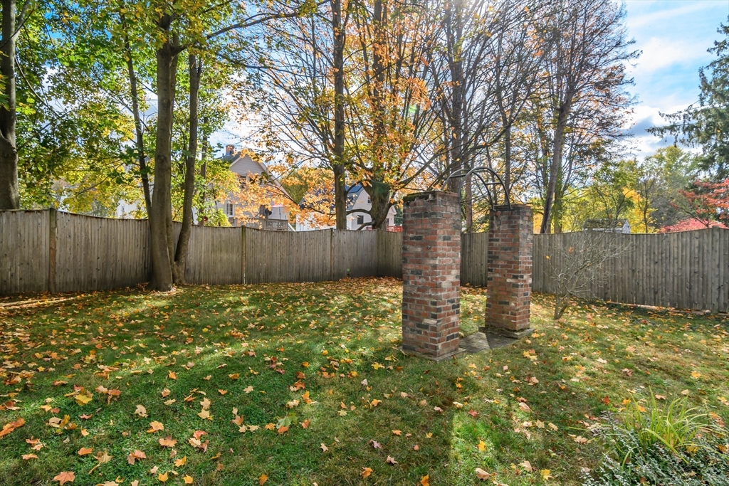 16 Alexander Street Framingham, MA 01702 - Photo 32 of 35 a backyard of a house with lots of green space