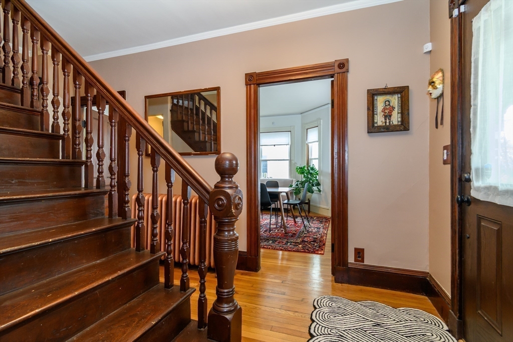 16 Alexander Street Framingham, MA 01702 - Photo 6 of 35 a view of entryway and hall with wooden floor
