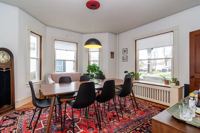 a view of a dining room with furniture and window