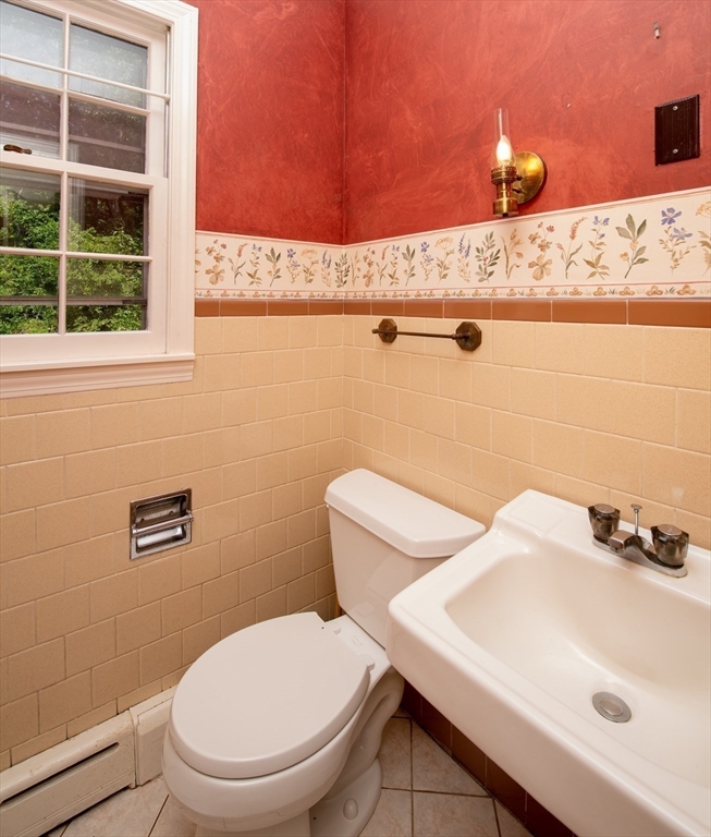 24 Ichabod Lane Marion, MA 02738 - Photo 17 of 35 a bathroom with a sink a toilet and a mirror