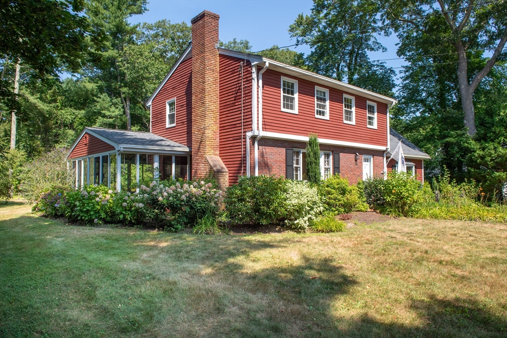 24 Ichabod Lane Marion, MA 02738 - Photo 2 of 35 a front view of a house with a yard