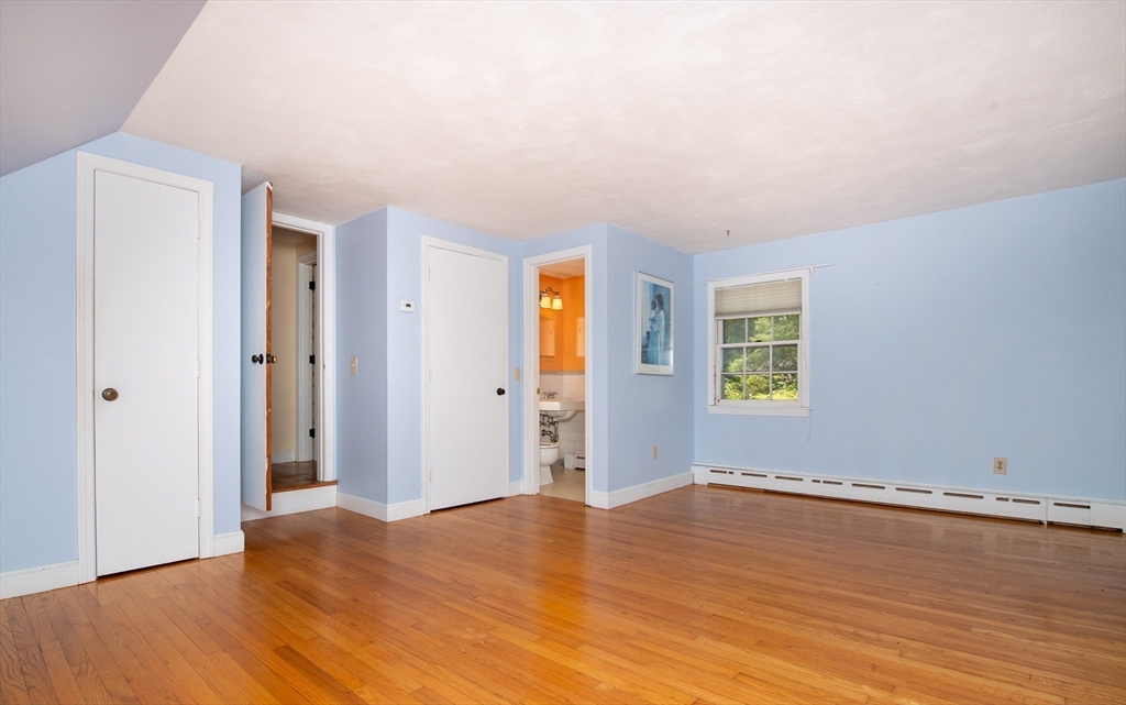 24 Ichabod Lane Marion, MA 02738 - Photo 22 of 35 a view of empty room with wooden floor and fan