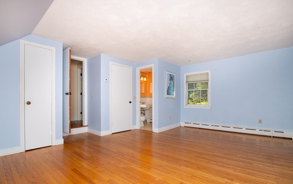 24 Ichabod Lane Marion, MA 02738 - Photo 23 of 35 a view of empty room with wooden floor and fan