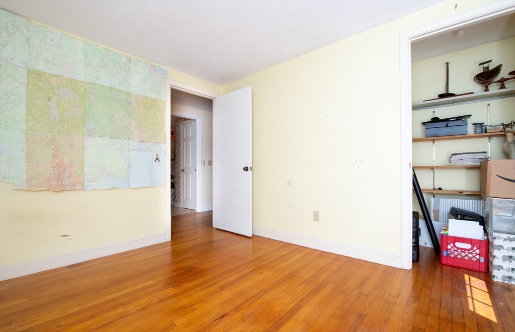 24 Ichabod Lane Marion, MA 02738 - Photo 24 of 35 an empty room with wooden floor and closet