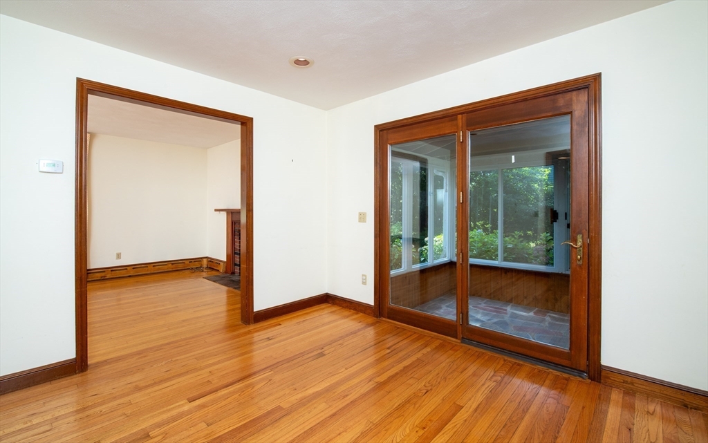 24 Ichabod Lane Marion, MA 02738 - Photo 7 of 35 an empty room with wooden floor and windows