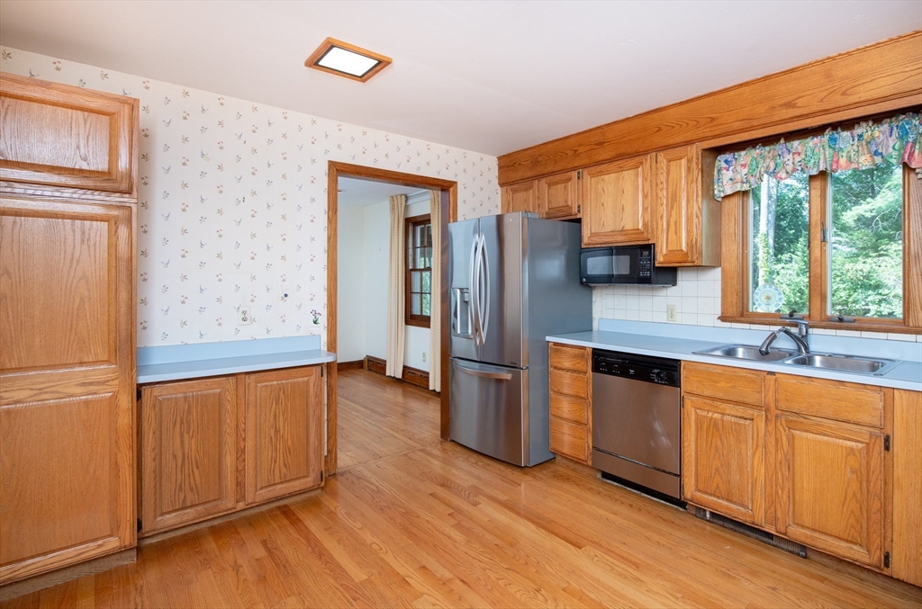 24 Ichabod Lane Marion, MA 02738 - Photo 10 of 35 a kitchen with stainless steel appliances granite countertop a refrigerator and a sink