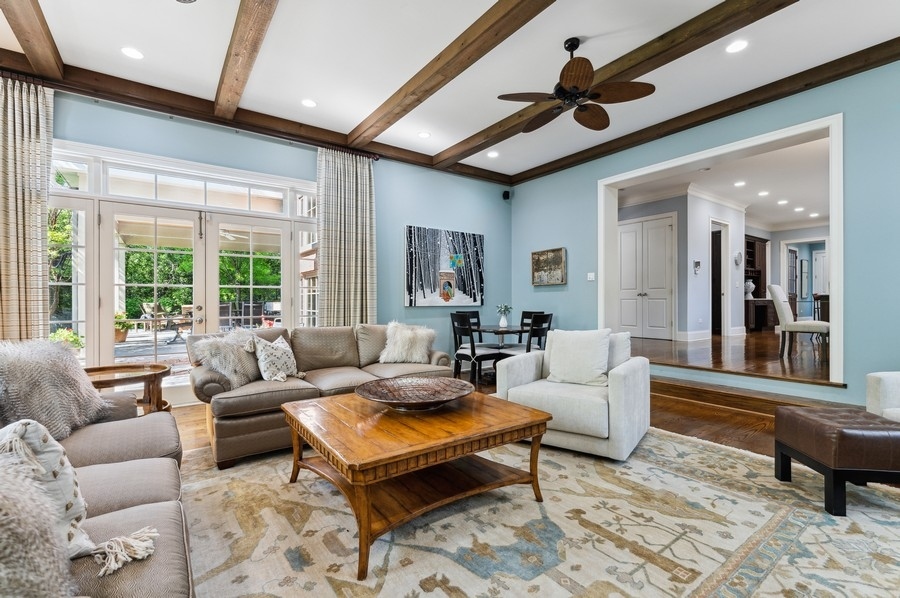 812 Hibbard Road Winnetka, IL 60093 - Photo 11 of 46 a living room with furniture a large window and a rug