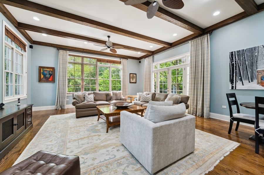 812 Hibbard Road Winnetka, IL 60093 - Photo 13 of 46 a living room with furniture and a large window