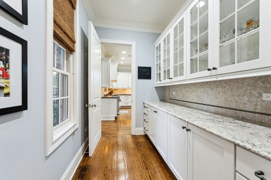 812 Hibbard Road Winnetka, IL 60093 - Photo 16 of 46 a kitchen with stainless steel appliances granite countertop a refrigerator and a stove
