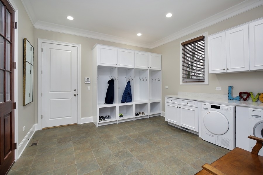 812 Hibbard Road Winnetka, IL 60093 - Photo 18 of 46 a large white kitchen with white cabinets