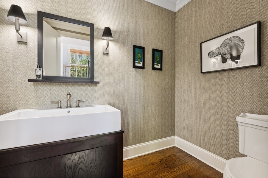 812 Hibbard Road Winnetka, IL 60093 - Photo 19 of 46 a bathroom with a sink mirror and toilet