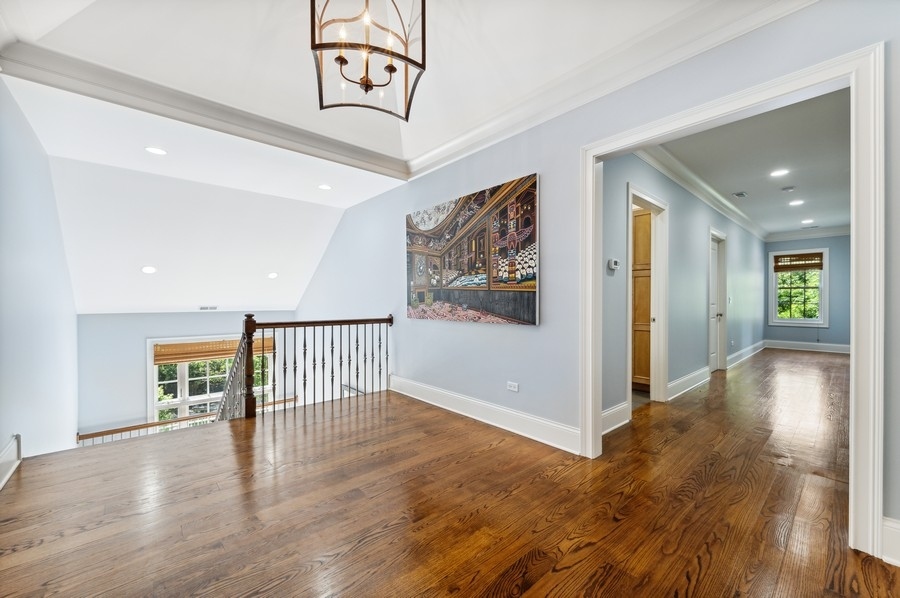 812 Hibbard Road Winnetka, IL 60093 - Photo 21 of 46 a view of a hallway with wooden floor