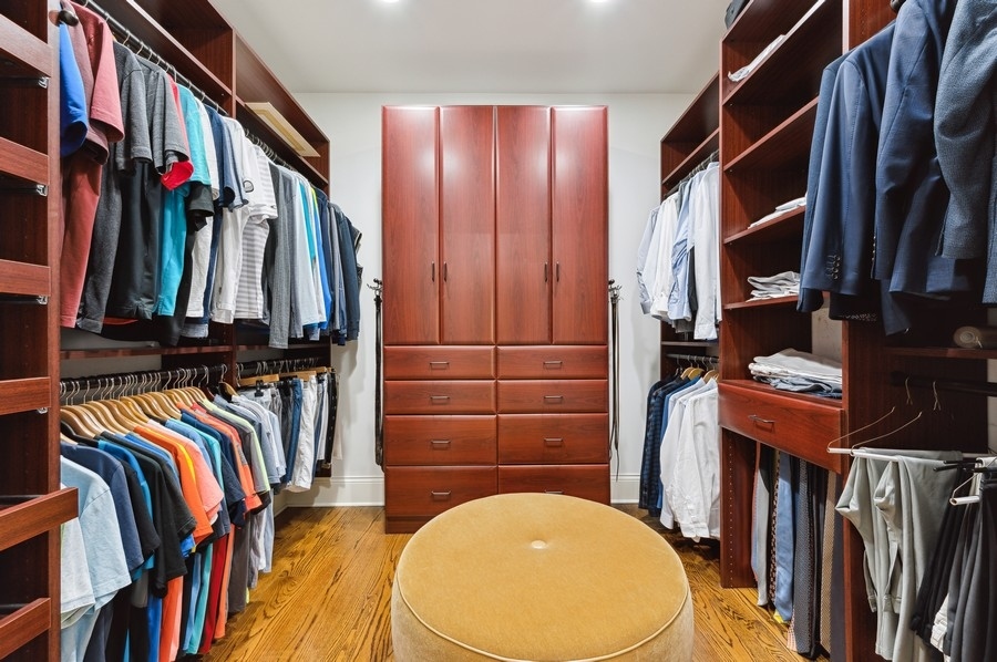 812 Hibbard Road Winnetka, IL 60093 - Photo 24 of 46 a view of walk in closet with clothes and shoes