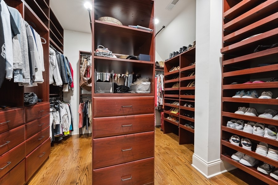 812 Hibbard Road Winnetka, IL 60093 - Photo 25 of 46 a view of walk in closet with clothes and shoes