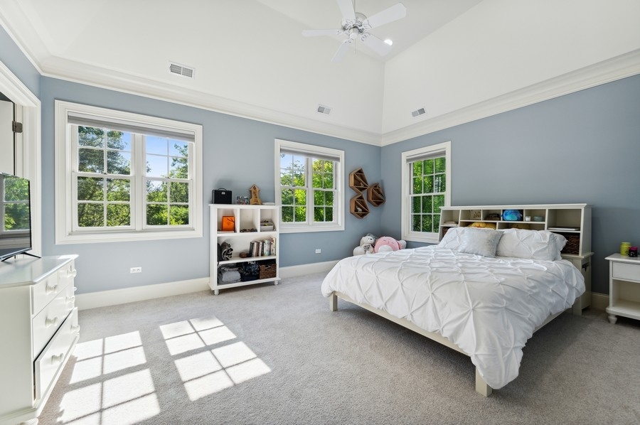 812 Hibbard Road Winnetka, IL 60093 - Photo 29 of 46 a bed room with a bed and a large window