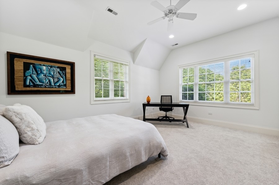 812 Hibbard Road Winnetka, IL 60093 - Photo 33 of 46 a bedroom with a bed and a couch