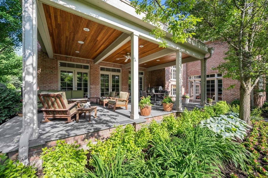 812 Hibbard Road Winnetka, IL 60093 - Photo 40 of 46 a view of backyard of house with outdoor seating and green space