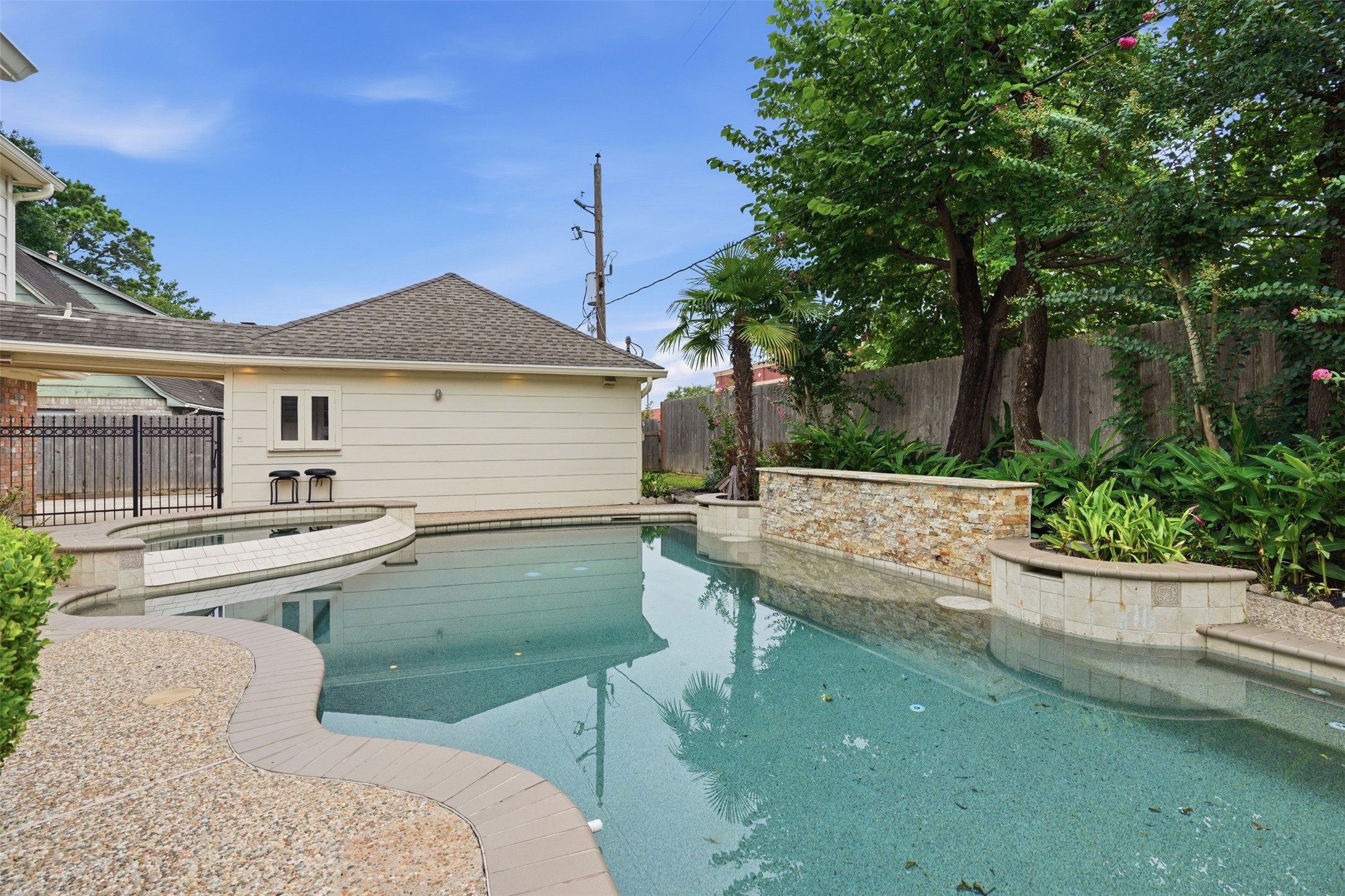 8310 Mentmore Drive Spring, TX 77379 - Photo 5 of 47 Enjoy outdoor living with plenty of patio space surrounding the pool, creating the ideal setting for gatherings with family and friends.