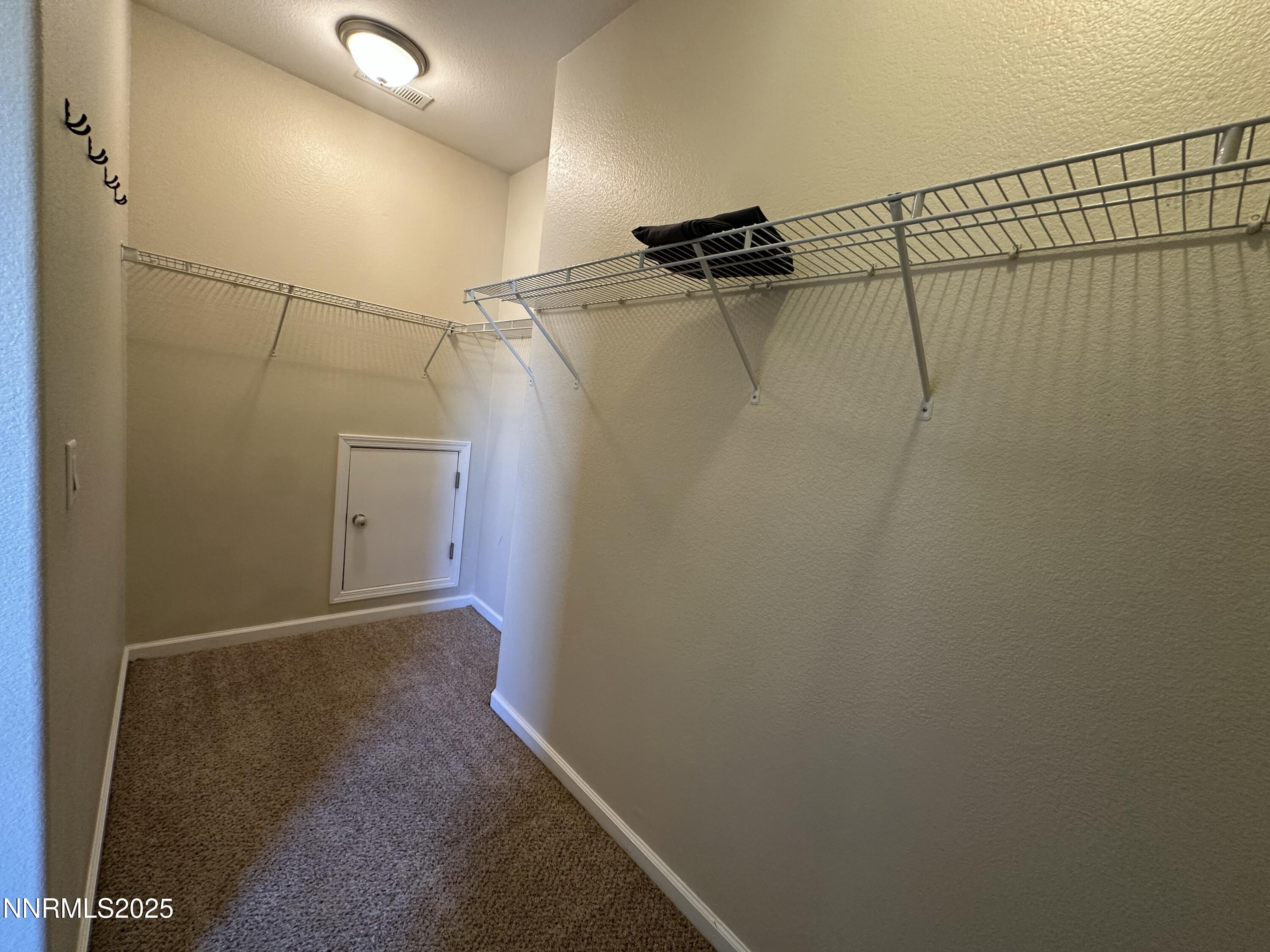 387 Orrcrest Drive Reno, NV 89506 - Photo 13 of 37 a view of a room with racks on the wall