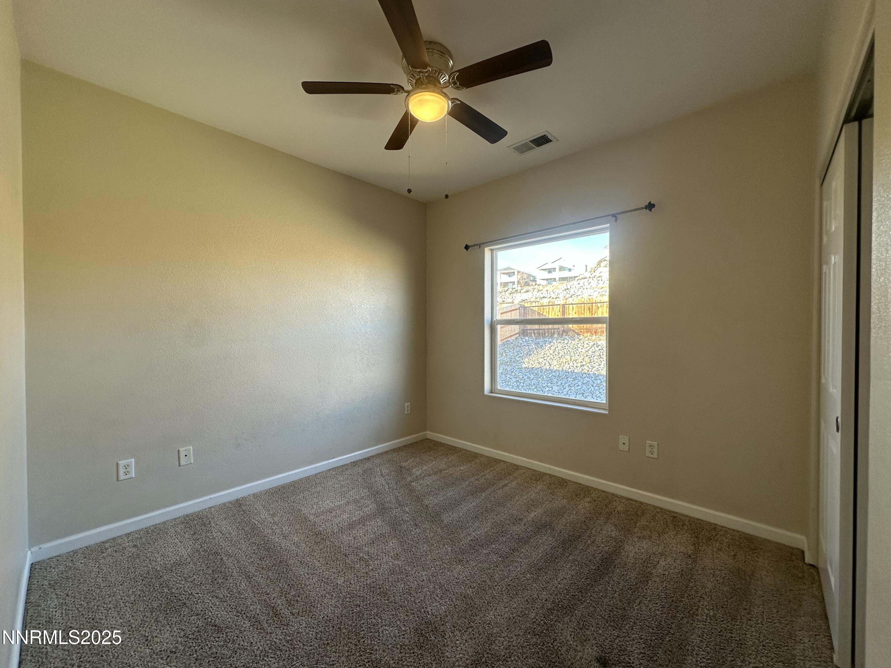 387 Orrcrest Drive Reno, NV 89506 - Photo 17 of 37 a view of an empty room and window