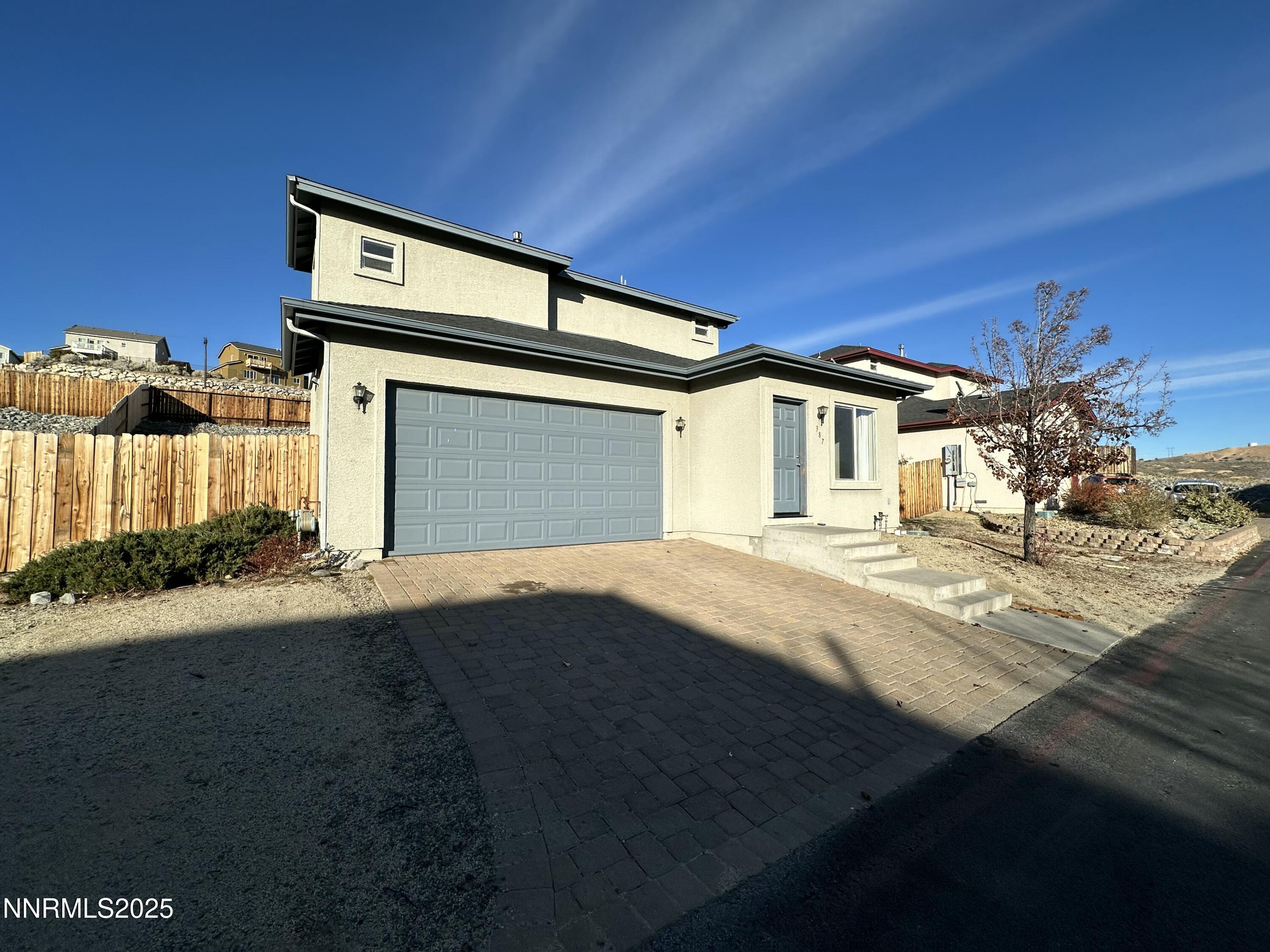 387 Orrcrest Drive Reno, NV 89506 - Photo 2 of 37 a front view of a house with a yard