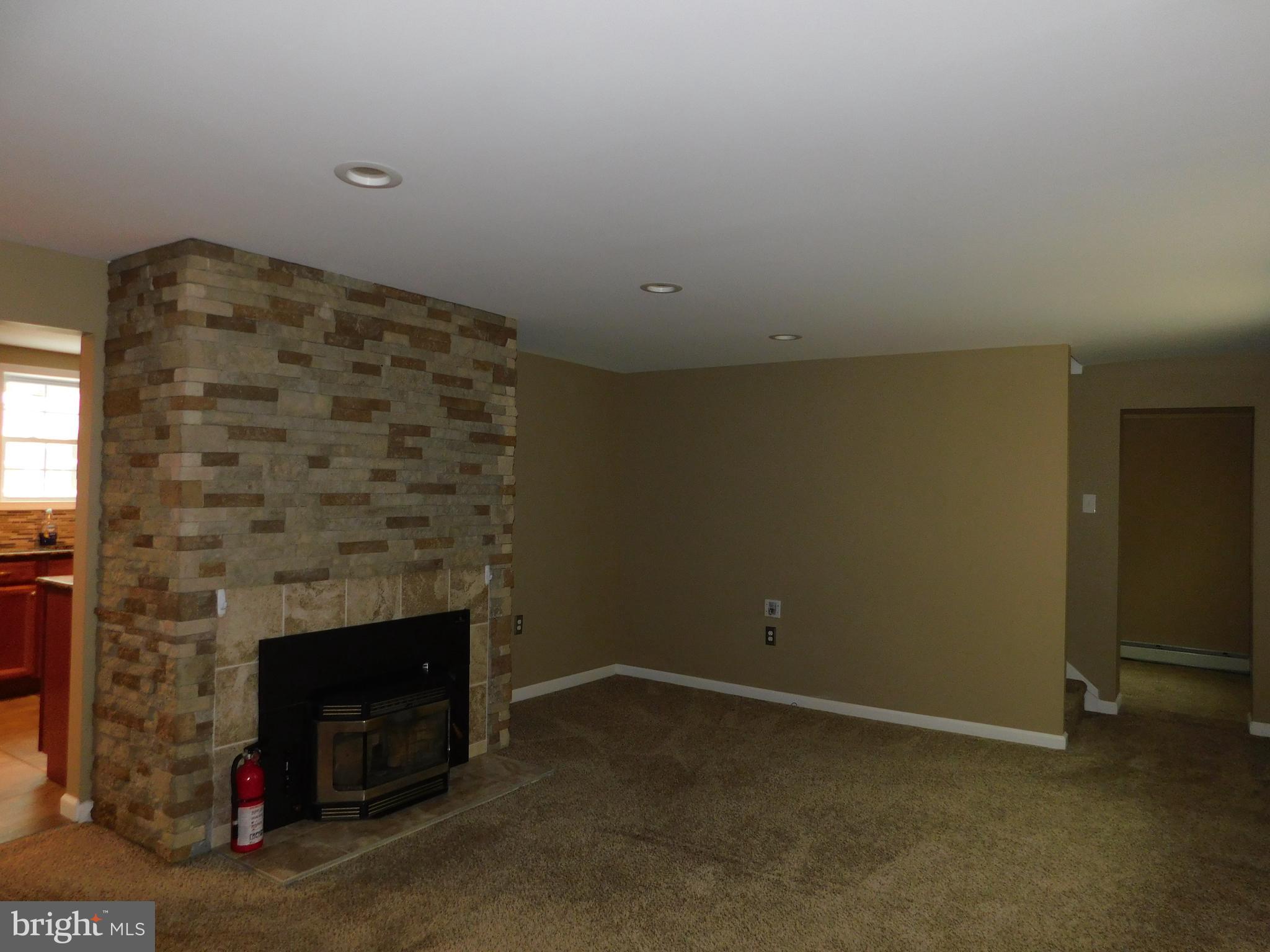 747 Churchville Road Southampton, PA 18966 - Photo 5 of 14 a view of empty room with a fireplace