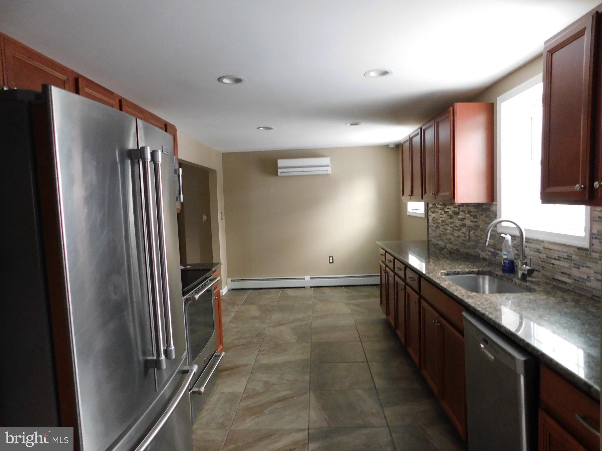 747 Churchville Road Southampton, PA 18966 - Photo 7 of 14 a kitchen with stainless steel appliances granite countertop a refrigerator and a sink