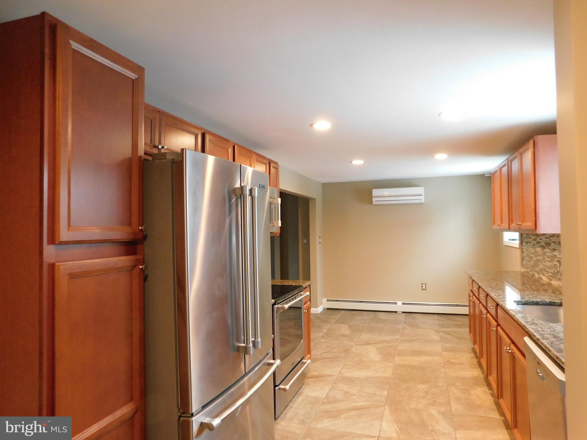 747 Churchville Road Southampton, PA 18966 - Photo 9 of 14 a view of a refrigerator in kitchen and a window