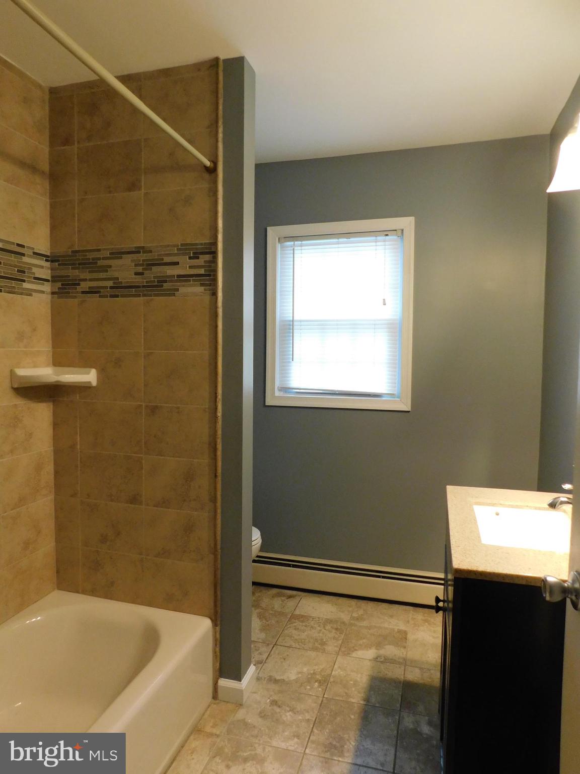 747 Churchville Road Southampton, PA 18966 - Photo 10 of 14 a bathroom with a bathtub and a shower