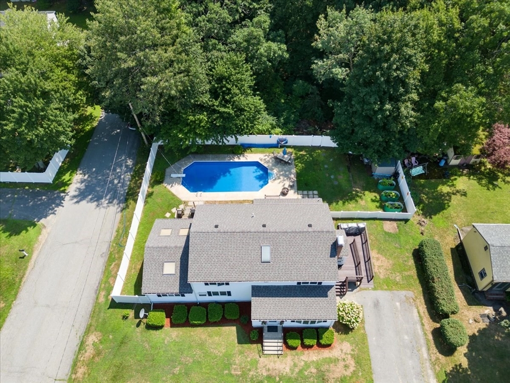 193 Lawrence Road Salem, NH 03079 - Photo 1 of 42 an aerial view of a house with swimming pool garden and patio