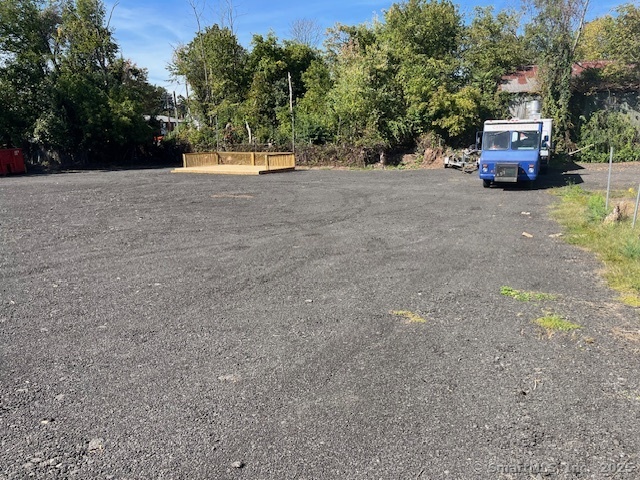 250 Pratt Street Meriden, CT 06450 - Photo 4 of 13 a view of a truck parked in a field
