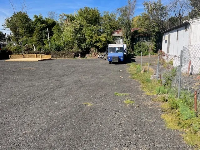 a view of street with parked cars