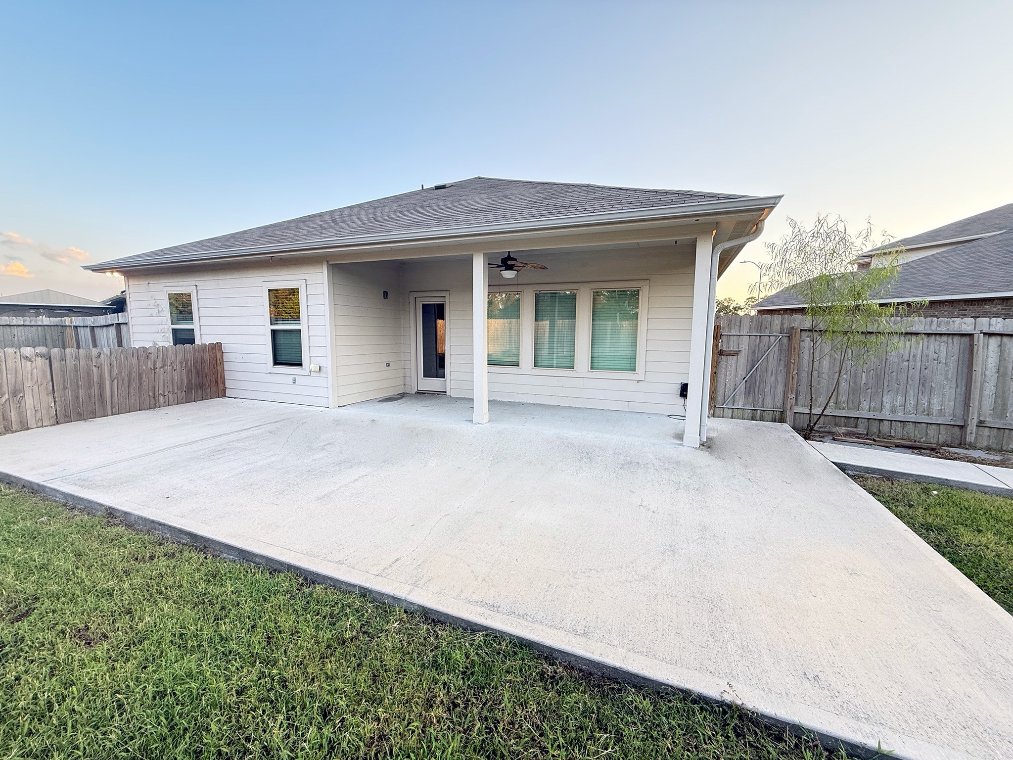 23726 Harrow Field Ln Spring Spring, TX 77373 - Photo 13 of 16 a view of a house with a small yard and wooden fence