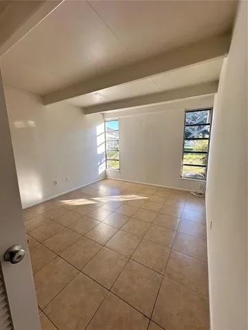 a view of an empty room and window