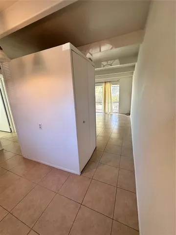 a view of a livingroom with an empty space and window