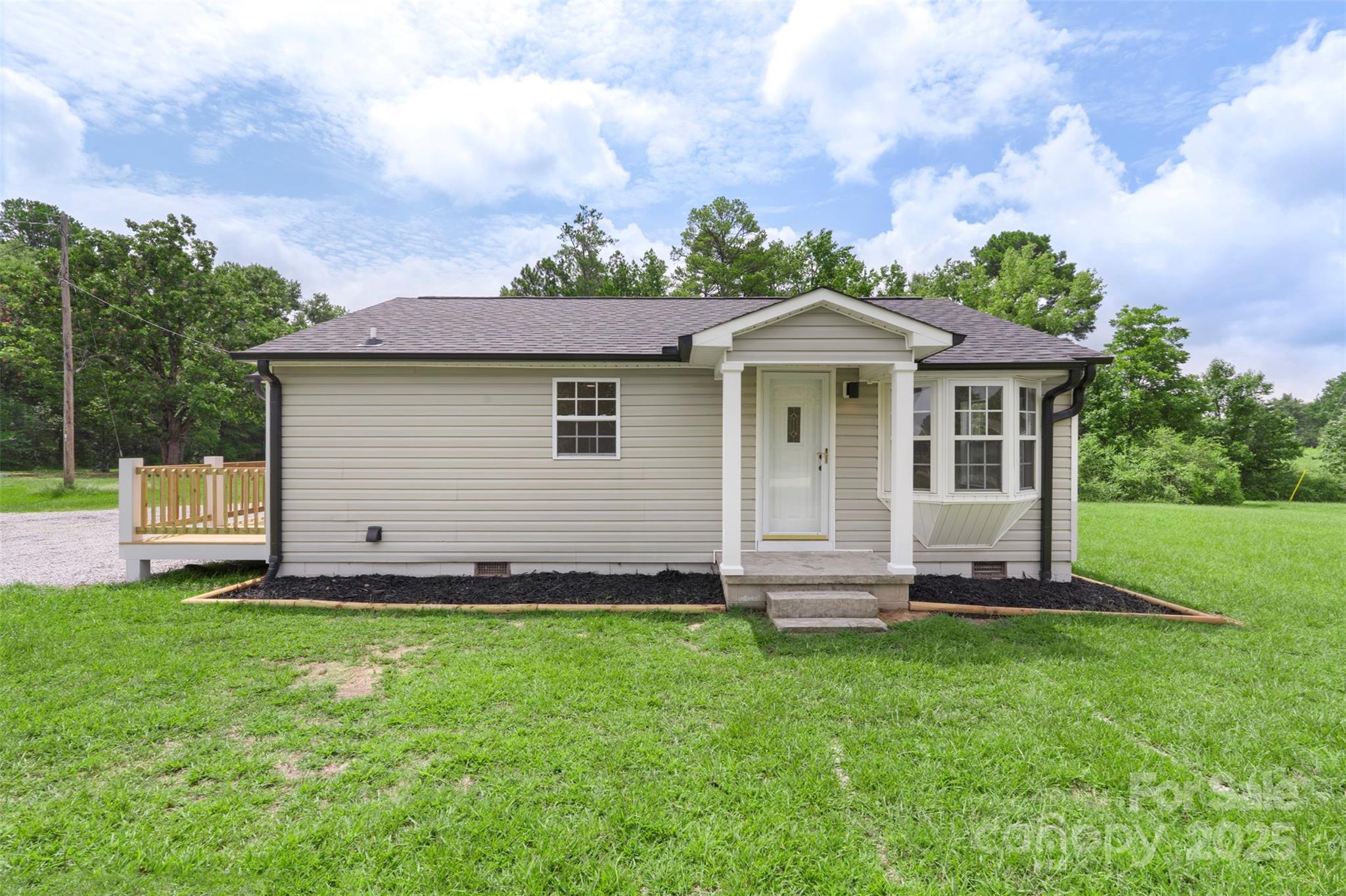 3114 Taxahaw Road Lancaster, SC 29720 - Photo 1 of 41 a front view of a house with a garden