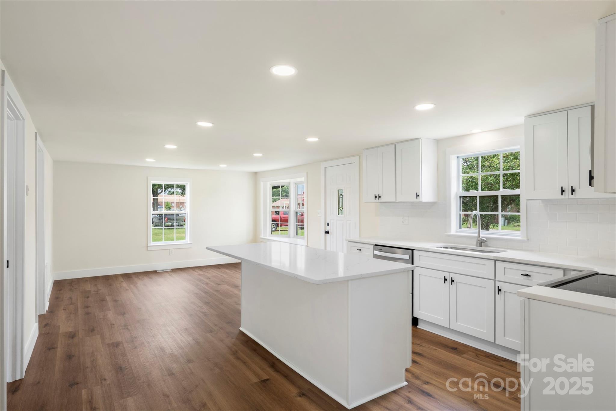 3114 Taxahaw Road Lancaster, SC 29720 - Photo 10 of 41 a large white kitchen with wooden floors and white walls