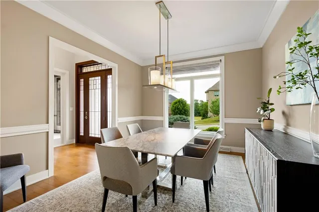 a view of a dining room with furniture window and outside view
