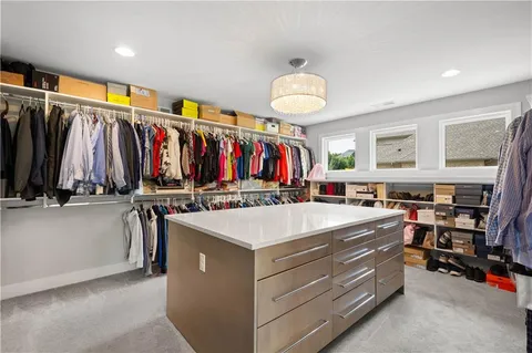 a view of a kitchen with furniture and a window