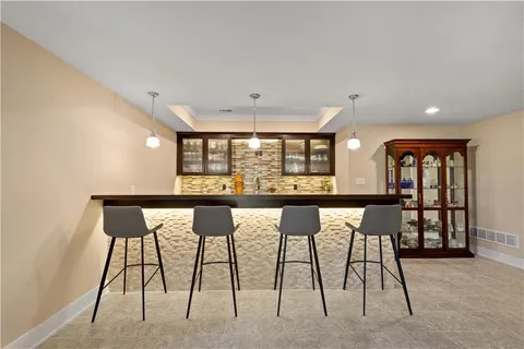 a view of a dining room with furniture and window