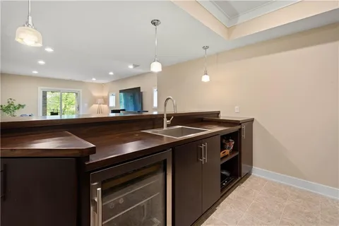 a kitchen with a sink and a stove top oven