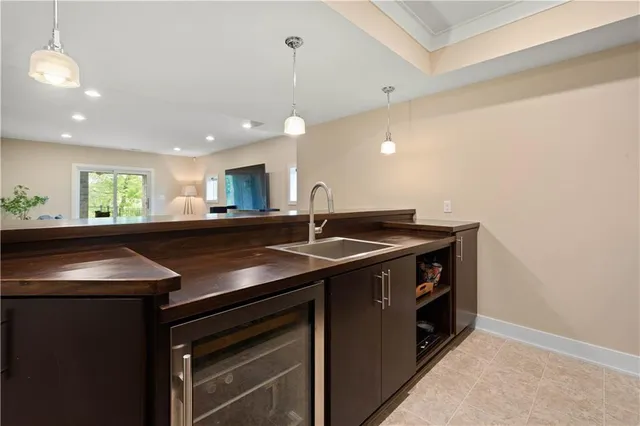 a kitchen with a sink and a stove top oven