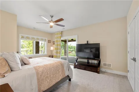 a bedroom with a bed and a couch