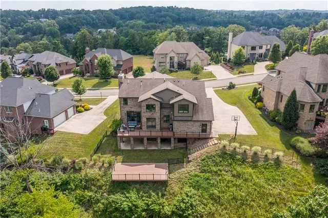 an aerial view of a house with a garden